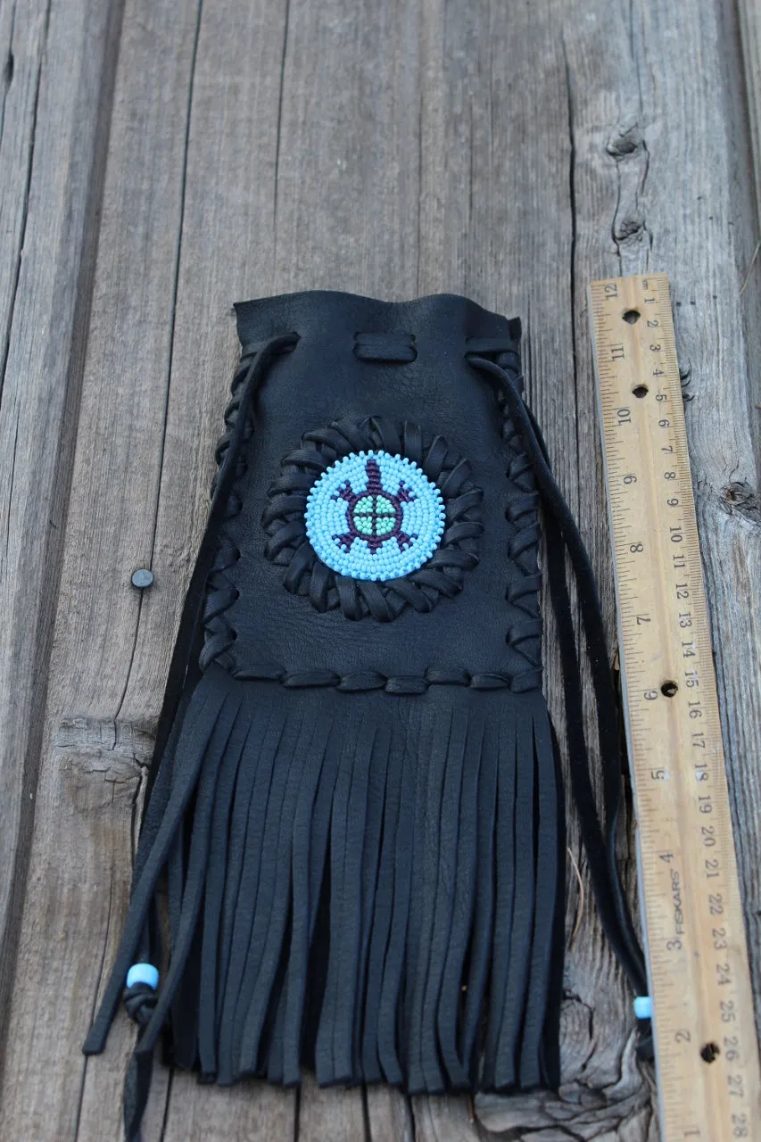 Fringed leather bag with beaded turtle totem