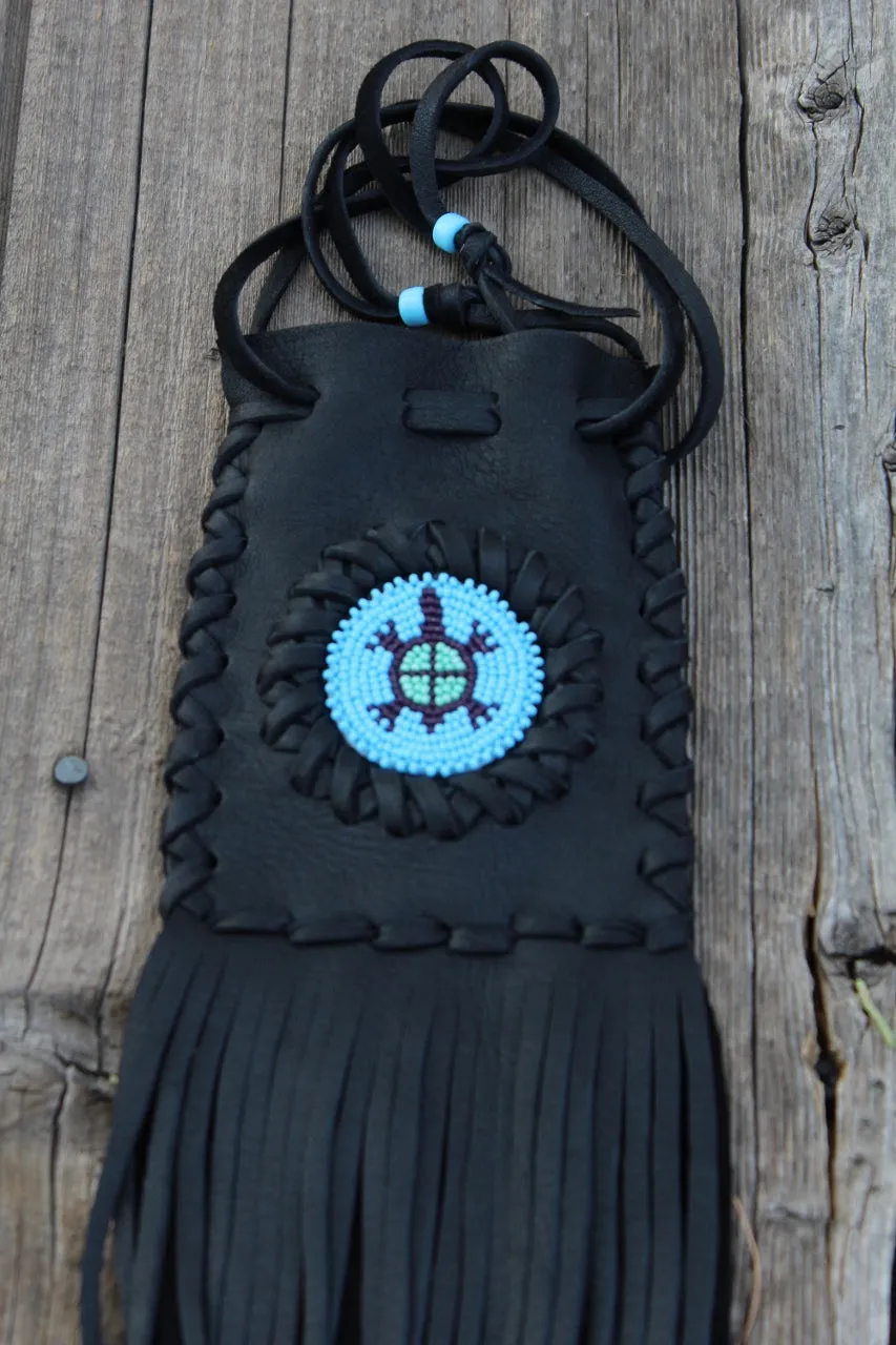 Fringed leather bag with beaded turtle totem