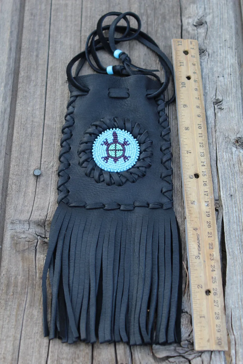 Fringed leather bag with beaded turtle totem